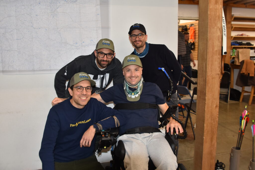 A group of friends stylishly dressed in River Deep Foundation hats joined us for a fun day of archery.